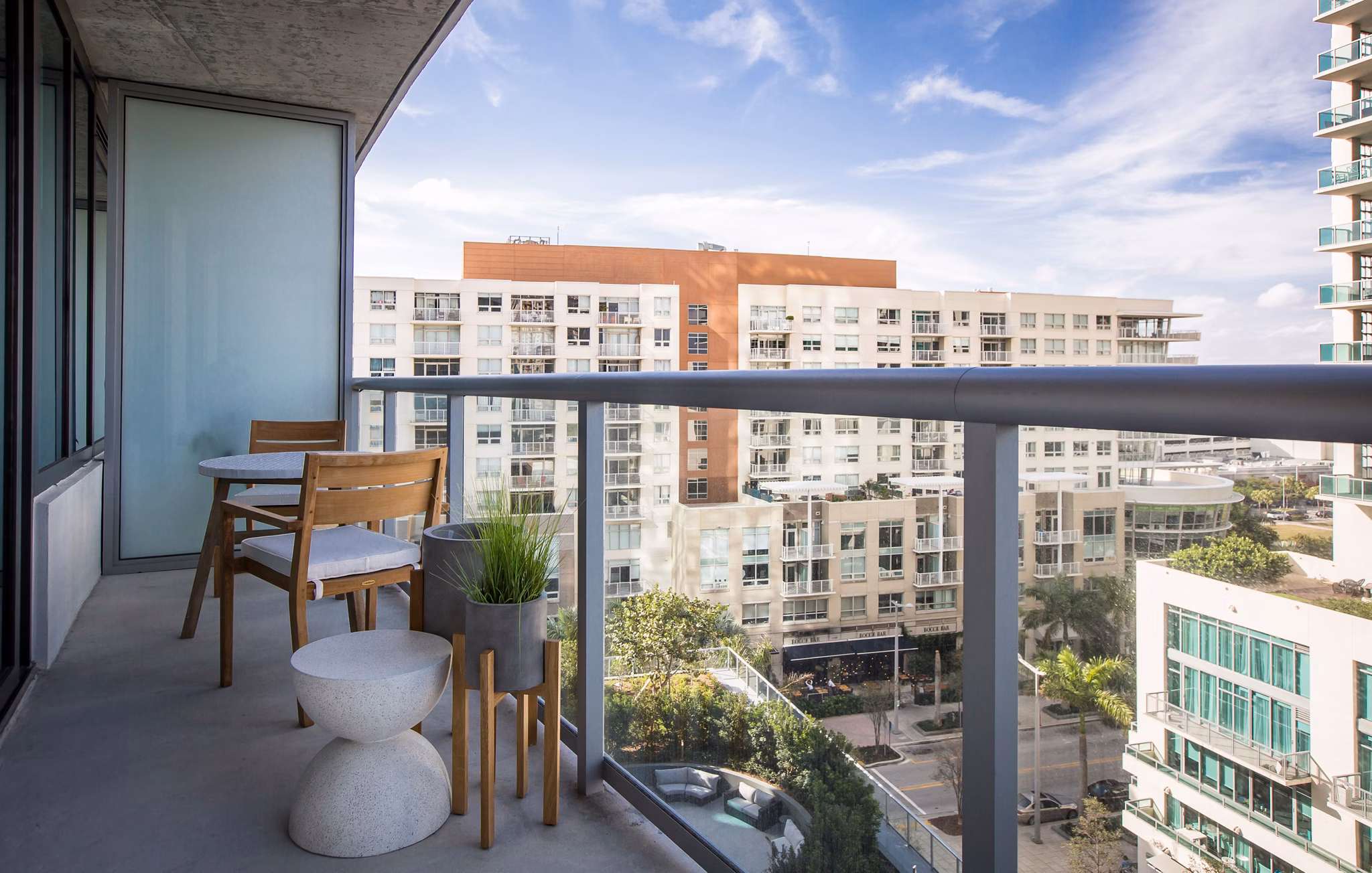 Spacious patio with modern furniture at Midtown 5 Apartments, offering luxury outdoor living in the heart of the city
