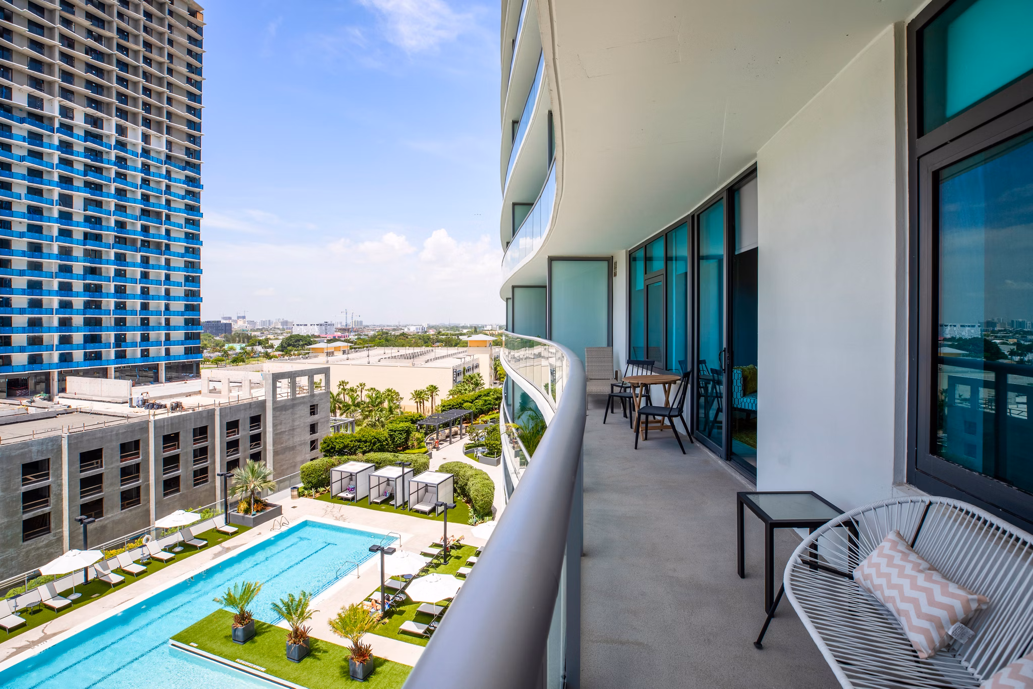 Patio with modern seating and lush greenery at Midtown 5 Apartments in the heart of a vibrant urban setting