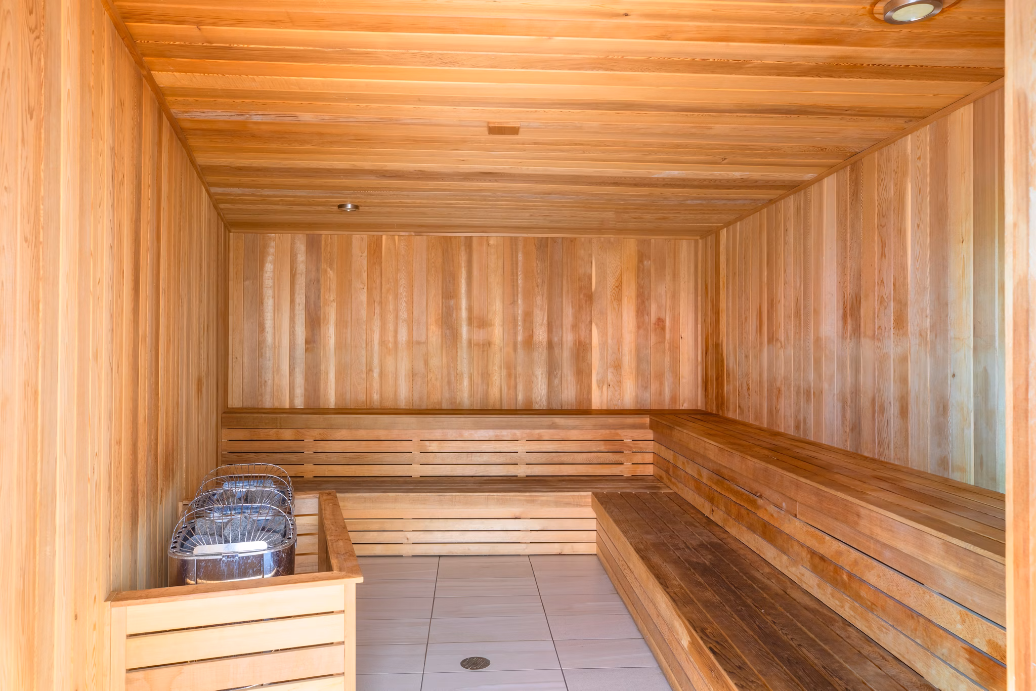 Tranquil sauna room with wood interiors at Midtown 5 Apartments offering relaxation and rejuvenation