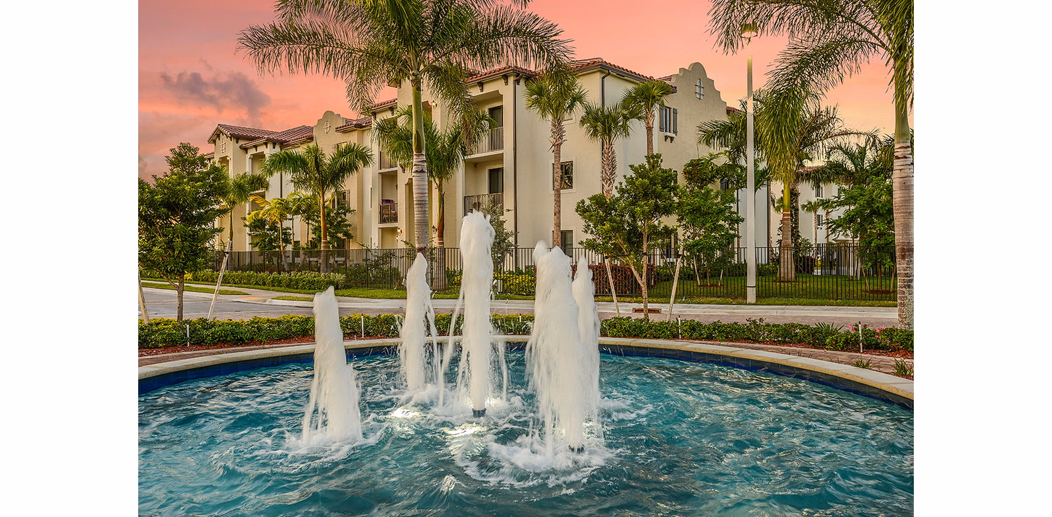 Celebration Pointe Apartments: Luxury view of modern apartment complex in tranquil setting
