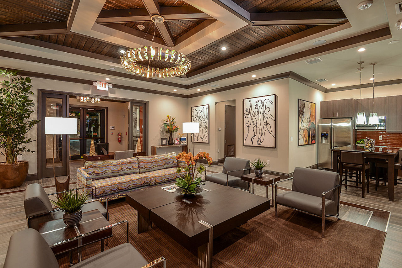Modern clubhouse with stylish seating and entertainment facilities at Celebration Pointe Apartments, ideal for social gatherings and community events