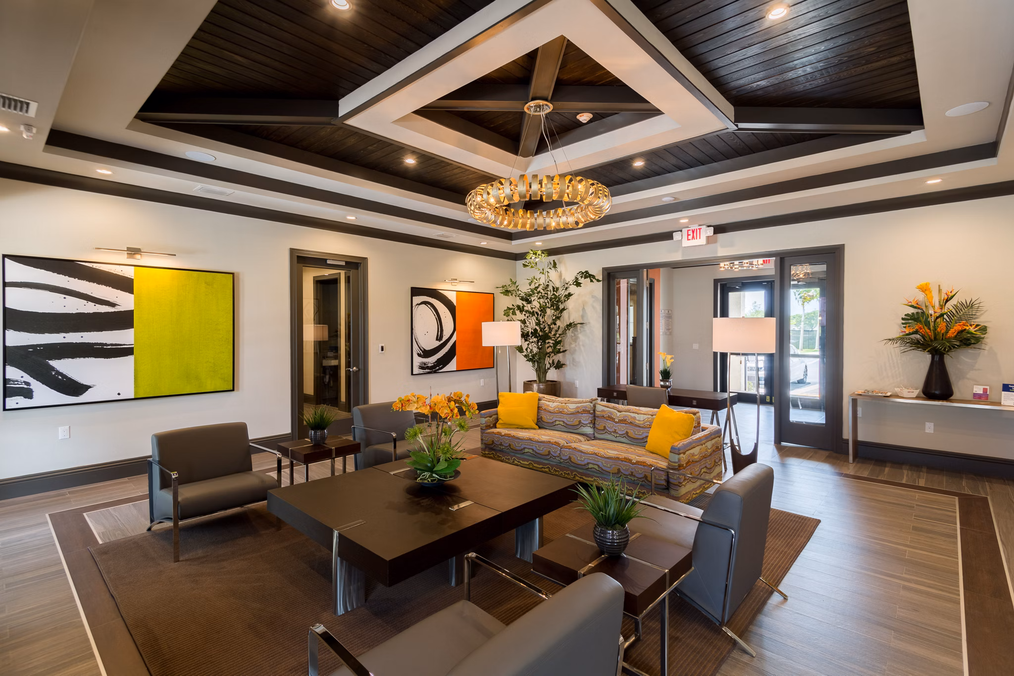 Modern clubhouse with billiards and seating area at Celebration Pointe Apartments, elegant space for social gatherings and resident events
