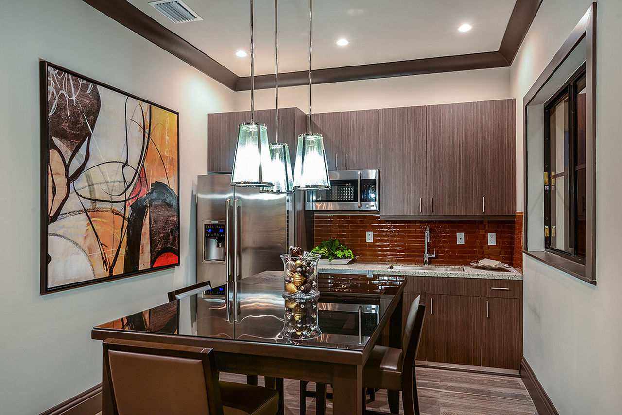 Dining area with modern furnishings at Celebration Pointe Apartments