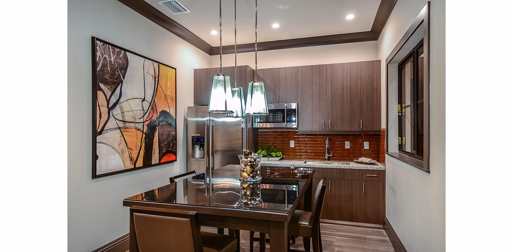 Dining area with modern furnishings at Celebration Pointe Apartments
