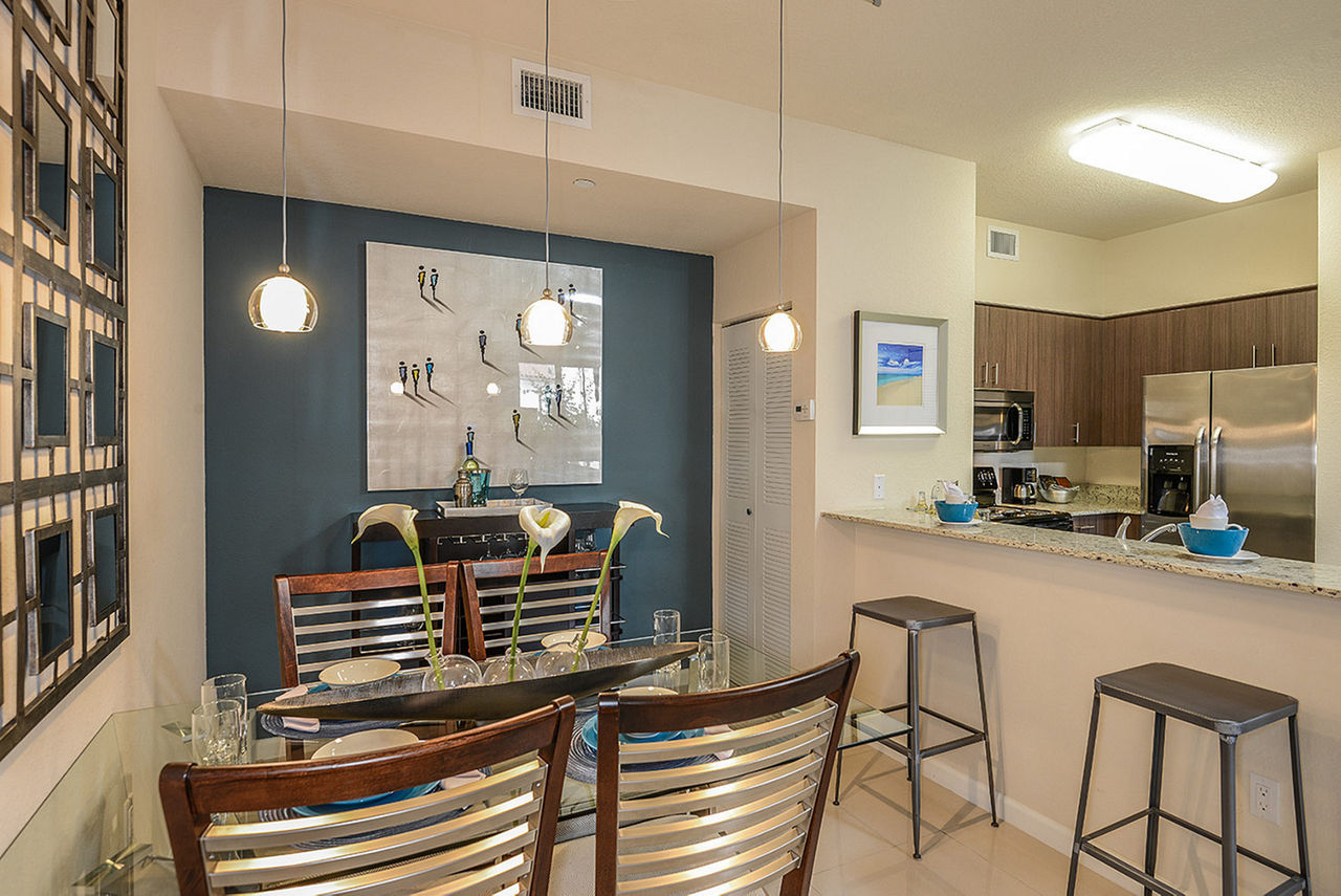 Elegant dining area with modern decor at Celebration Pointe Apartments