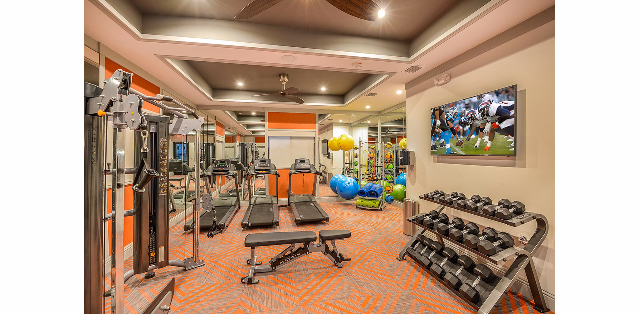 Modern fitness center with state-of-the-art equipment at Celebration Pointe Apartments, ideal for active lifestyles