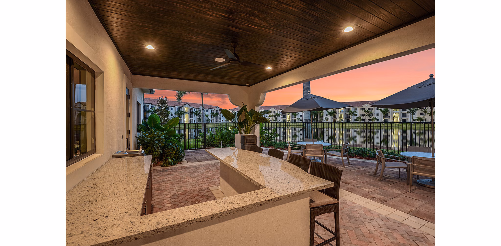 Cozy outdoor patio with seating area at Celebration Pointe Apartments