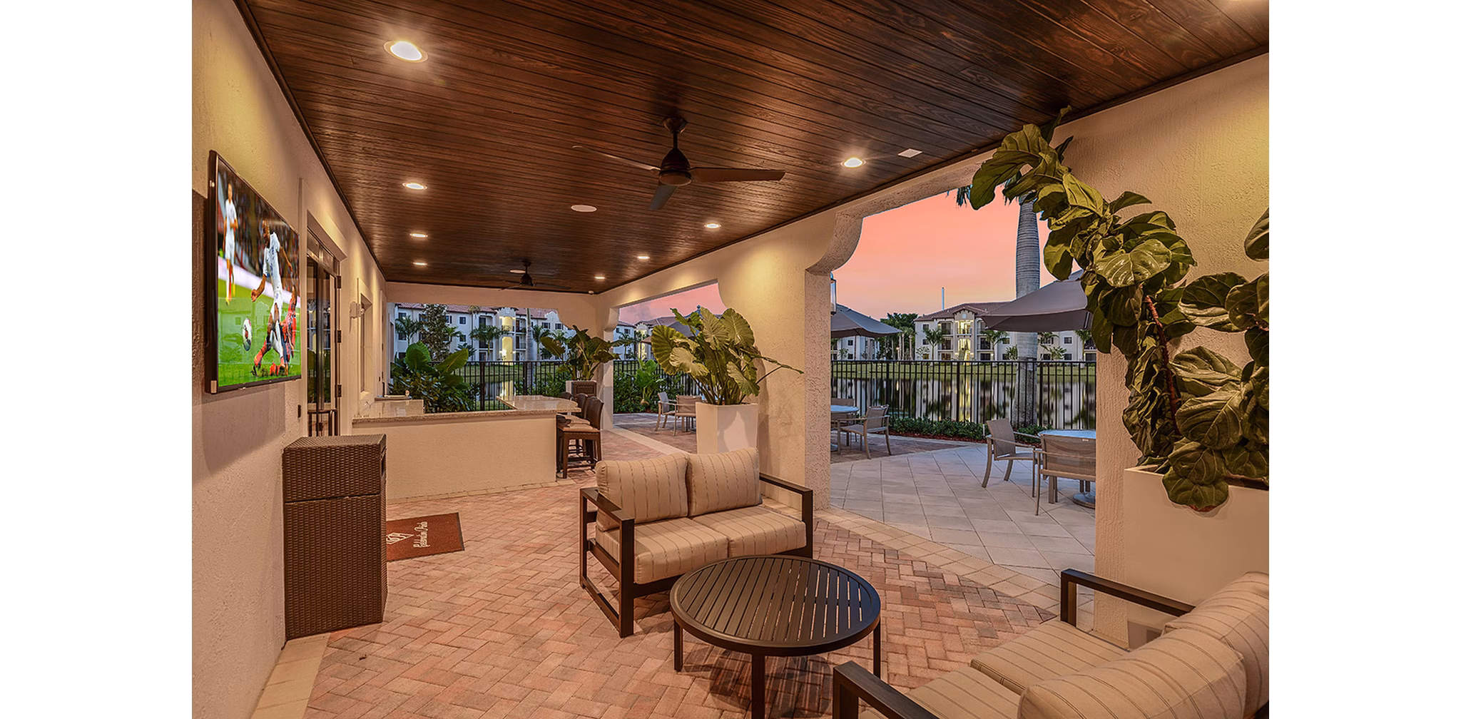 Charming patio with modern seating at Celebration Pointe Apartments, an inviting space for residents to relax outdoors