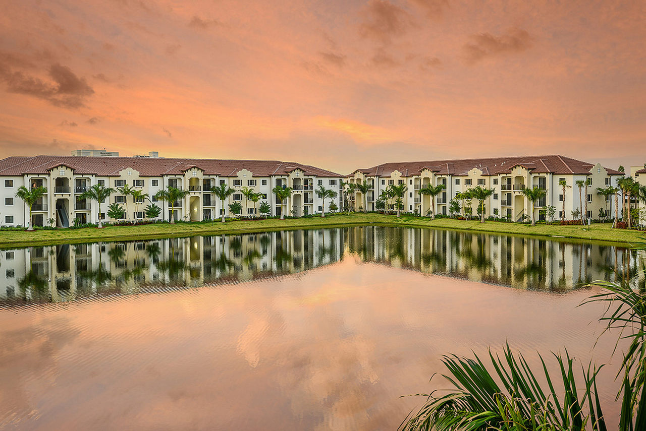 Celebration Pointe Apartments: Scenic view of luxury apartments with lush landscaping
