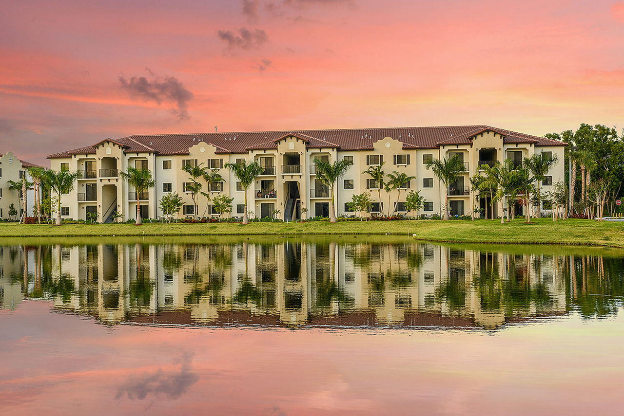 Celebration Pointe Apartments: Scenic view of modern courtyard with landscaped gardens and walking paths