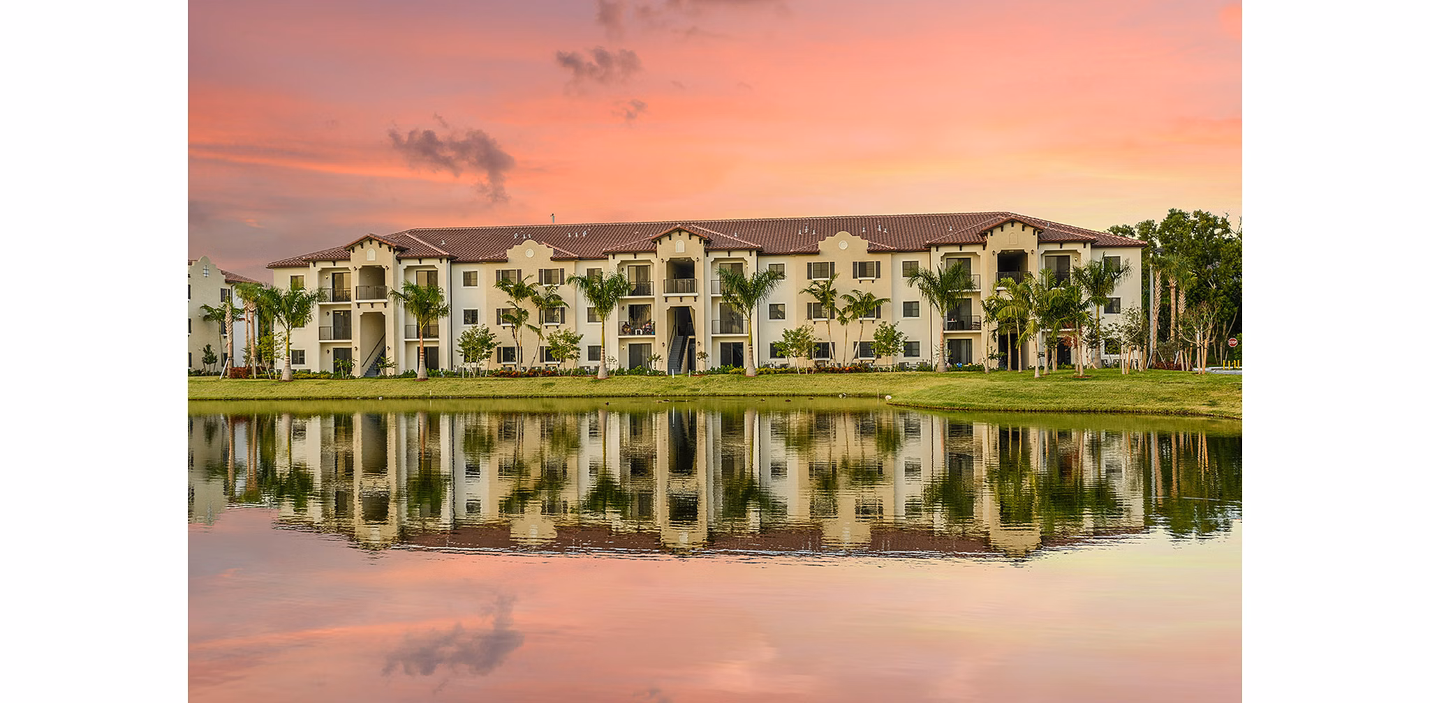Celebration Pointe Apartments: Scenic view of modern courtyard with landscaped gardens and walking paths