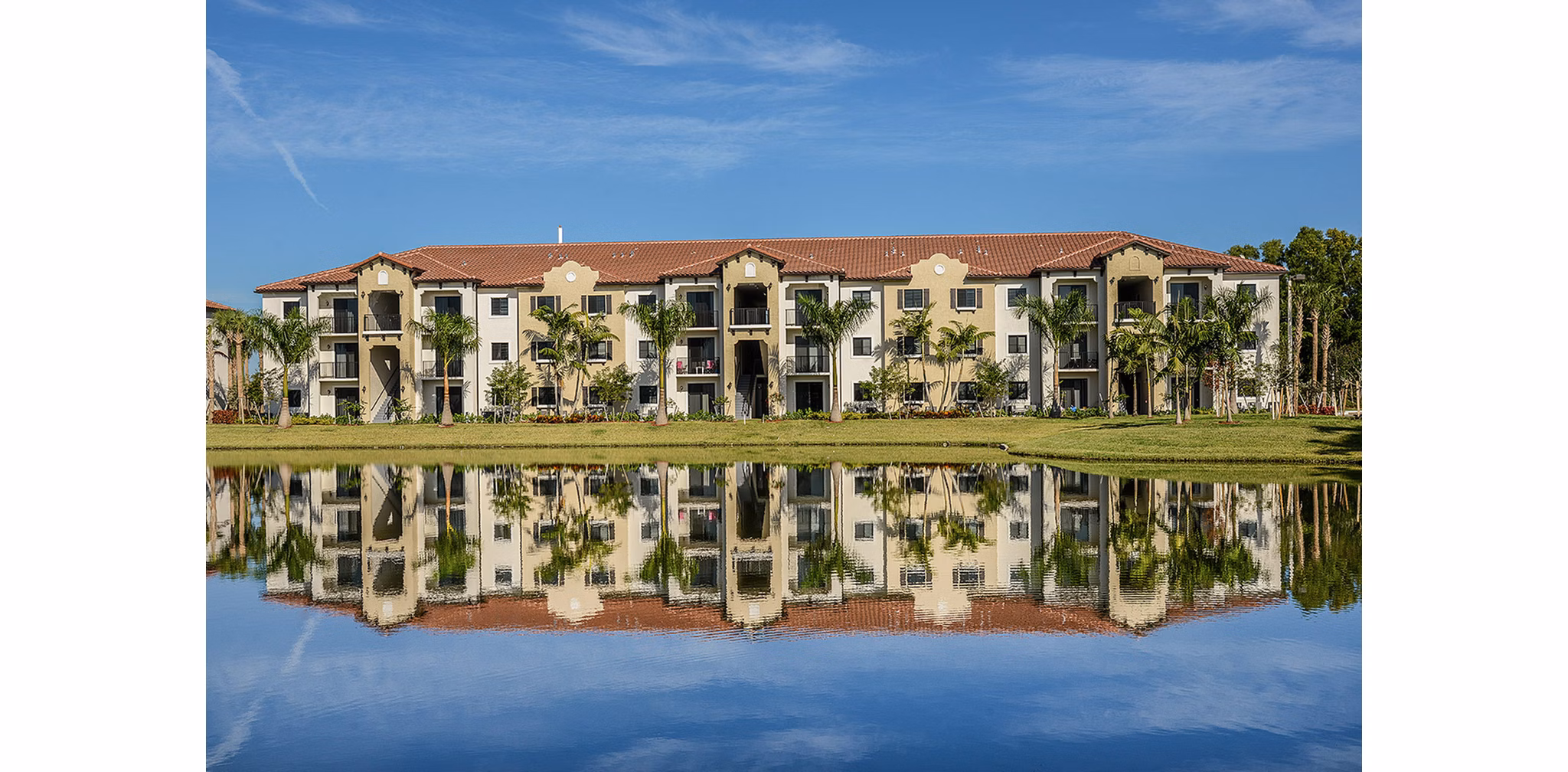 Celebration Pointe Apartments: Scenic view of the landscaped gardens from a luxury balcony, enhancing the serene living experience