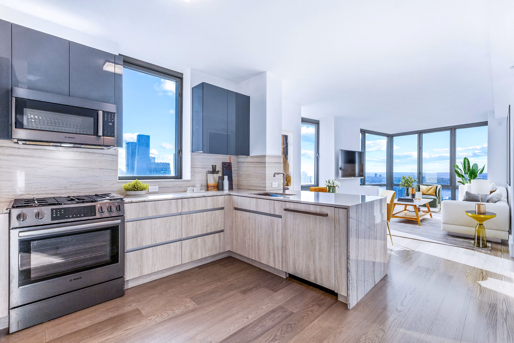 Modern kitchen with stainless steel appliances at The Biltmore Apartments, a Greystar community