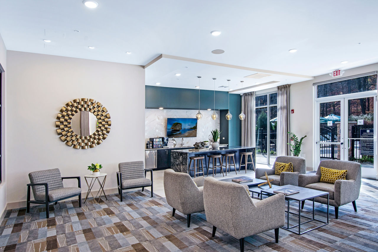 Woodgrove at Sterlington Apartments: Elegant clubhouse featuring modern design and comfortable seating