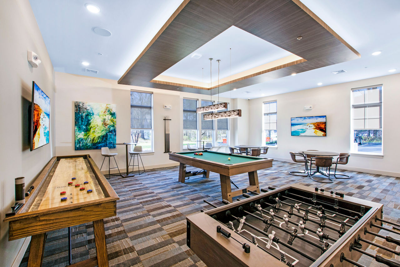 Woodgrove at Sterlington: Modern game room with pool table and lounge seating in luxury apartments