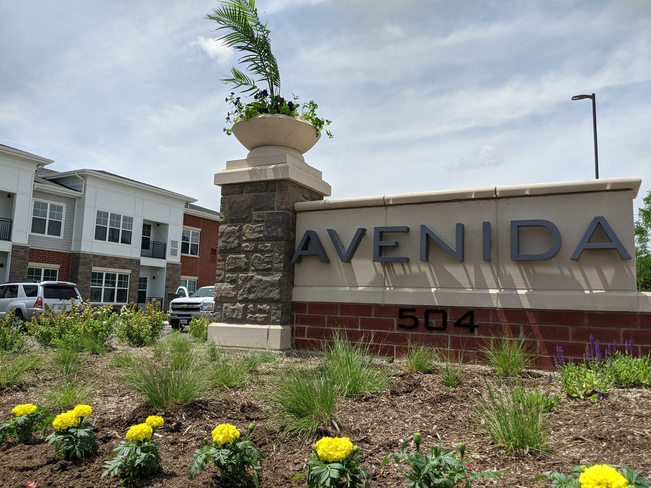 Avenida Naperville: Elegant signage at luxury apartments in central Naperville