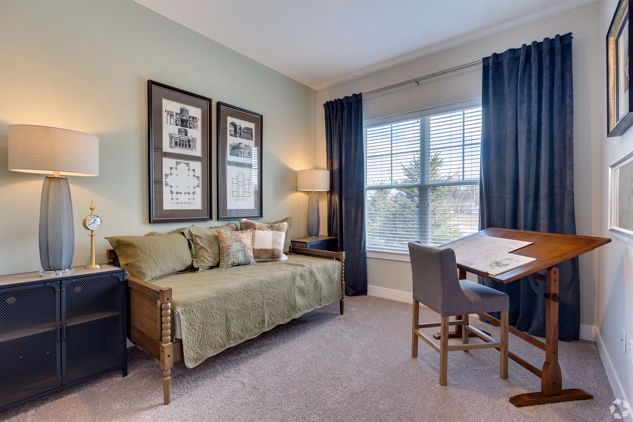 Bedroom with modern furniture and cozy lighting at Avenida Naperville Apartments