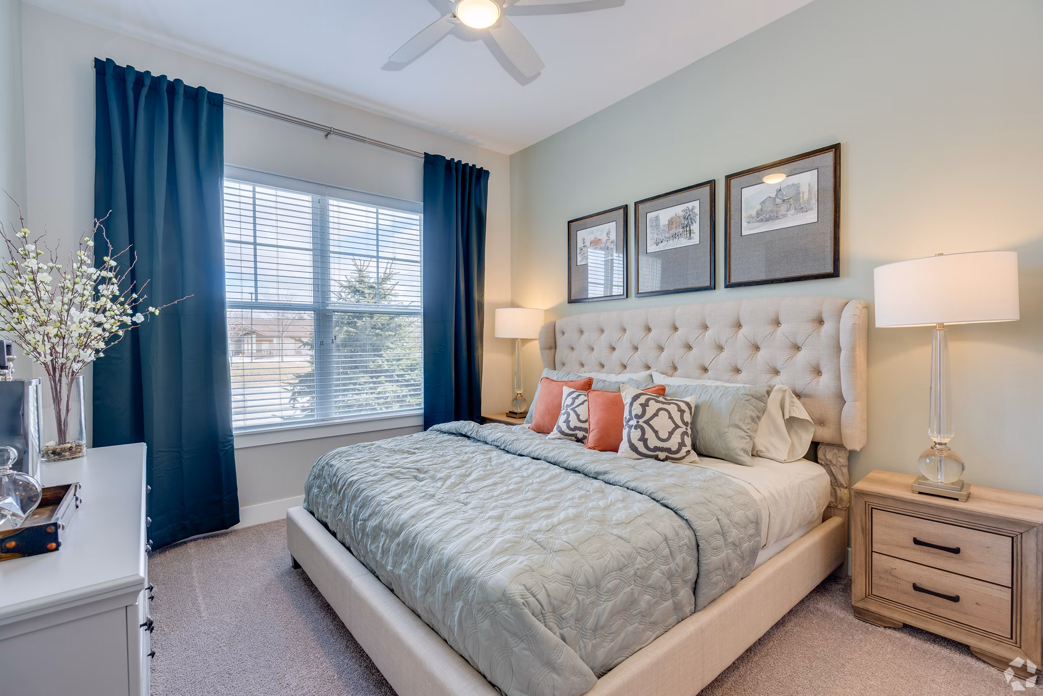 Cozy bedroom with soft lighting and modern decor at Avenida Naperville Apartments, featuring a spacious layout and serene ambiance