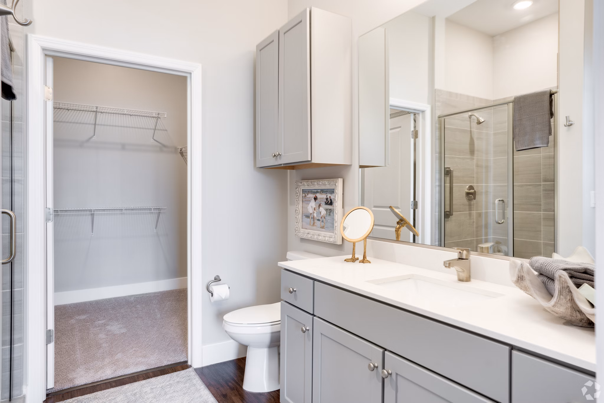 Bathroom featuring modern fixtures and marble countertops at Avenida Naperville Apartments