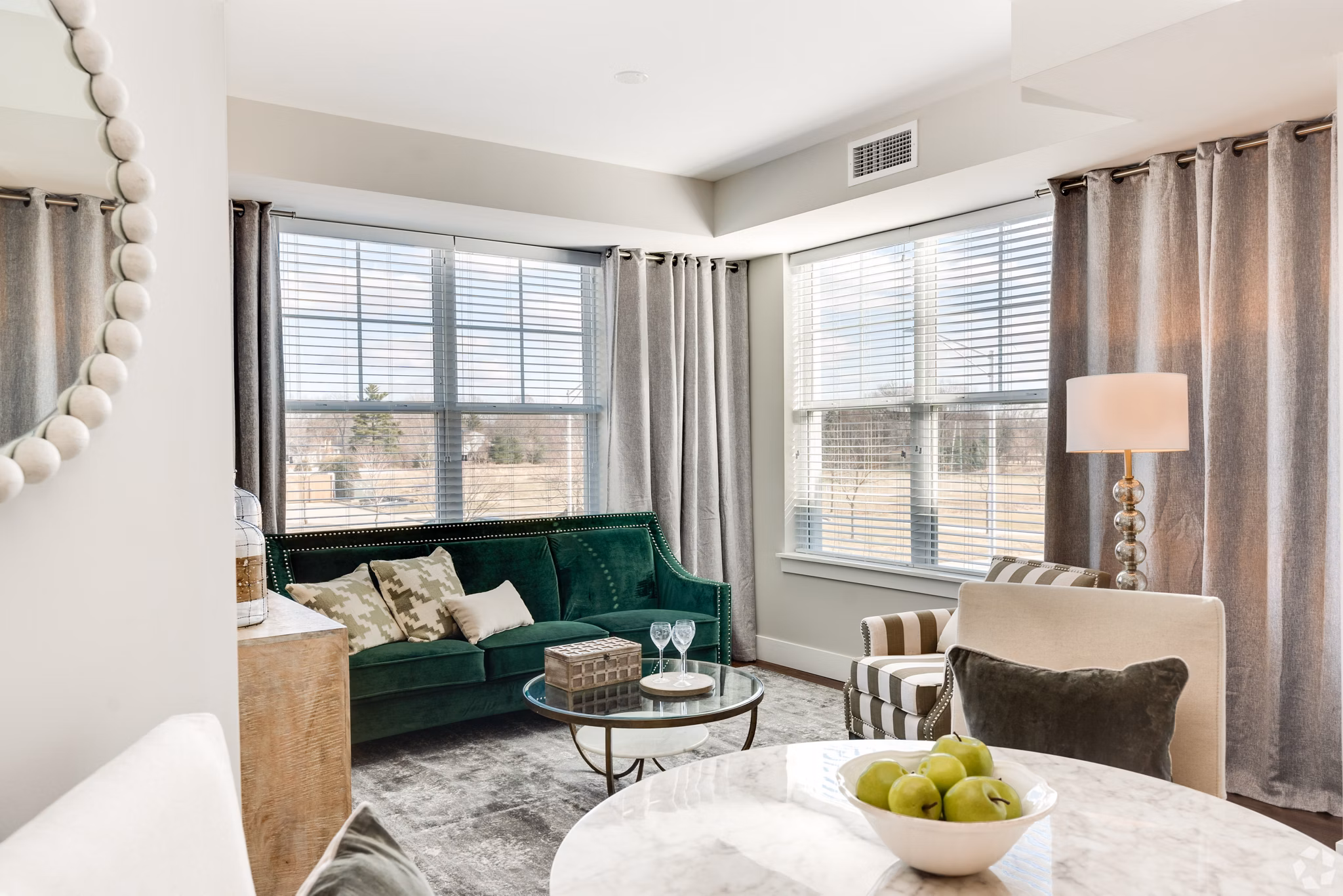 Dining area with modern furnishings at Avenida Naperville Apartments, featuring elegant lighting and spacious layout for luxury living