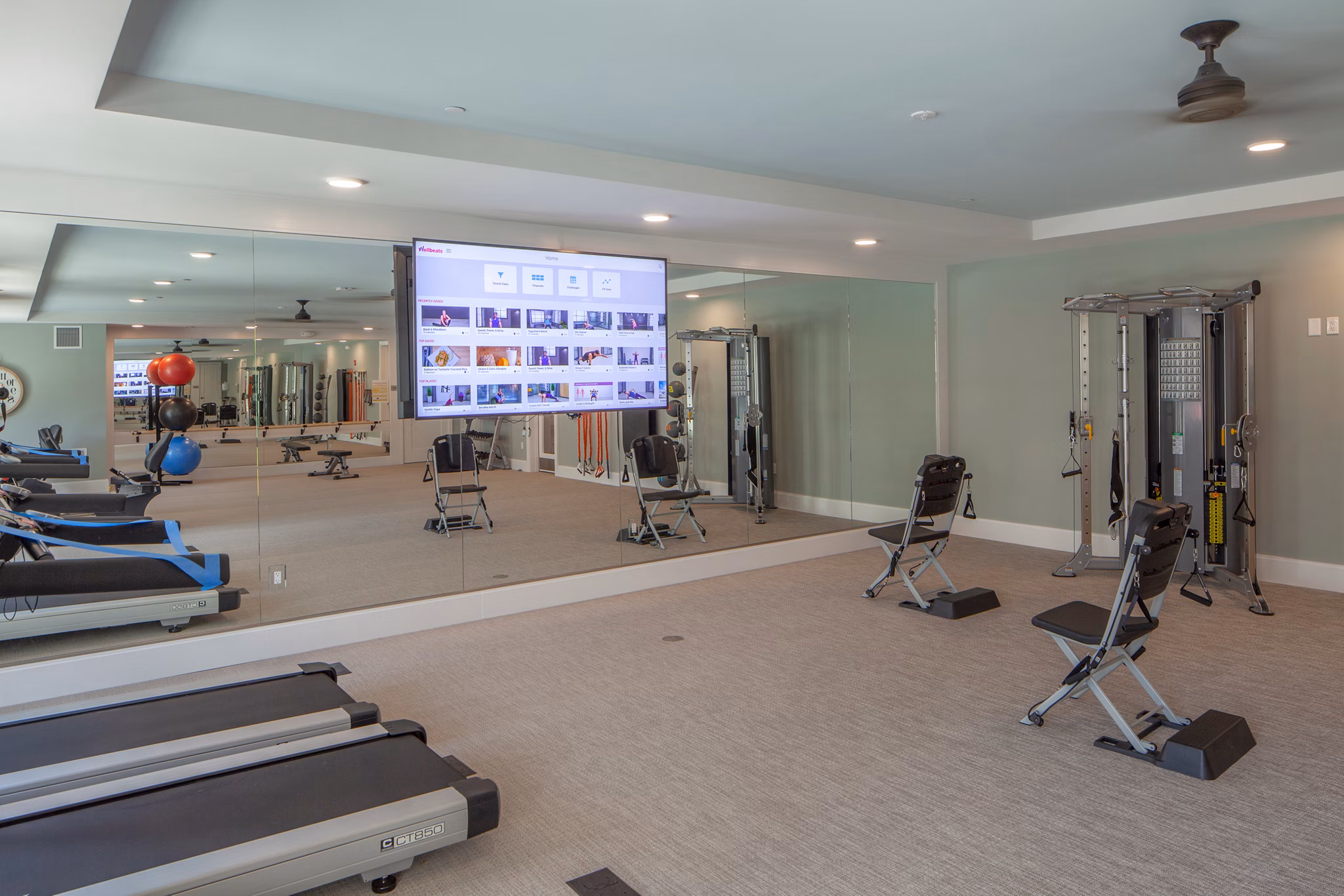 State-of-the-art fitness center with modern equipment at Avenida Naperville Apartments offering luxury living in a vibrant community