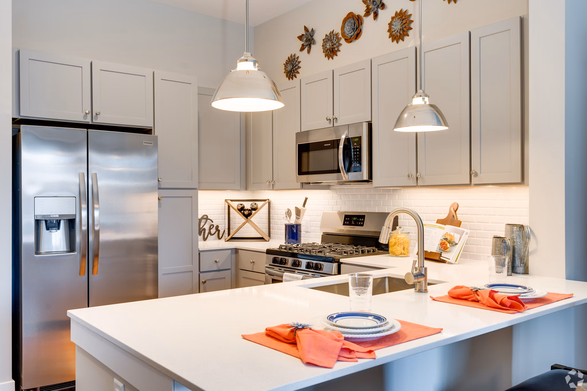 Modern kitchen with stainless steel appliances at Avenida Naperville Apartments, a luxury property offering elegant living spaces