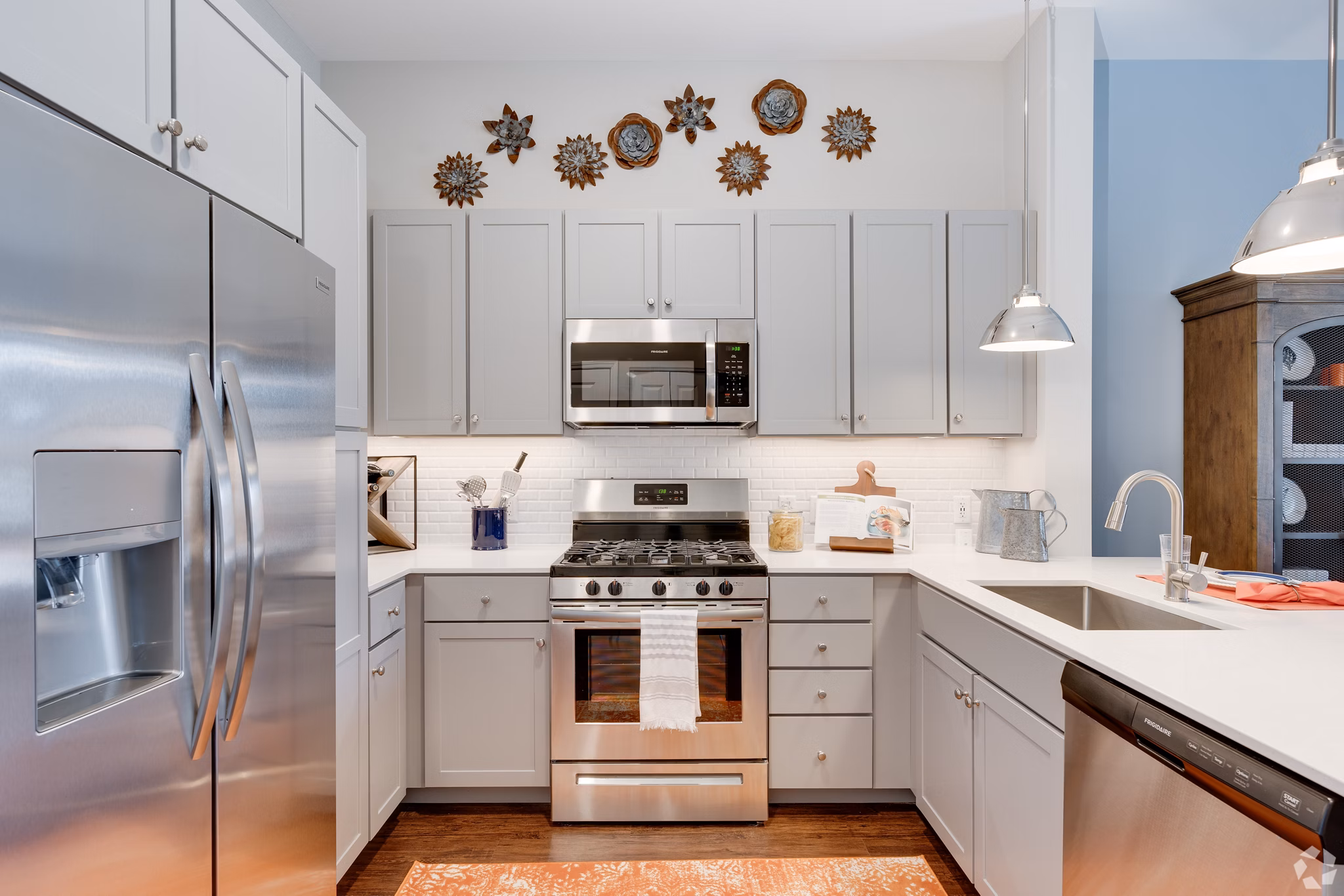 Modern kitchen with stainless steel appliances at Avenida Naperville Apartments