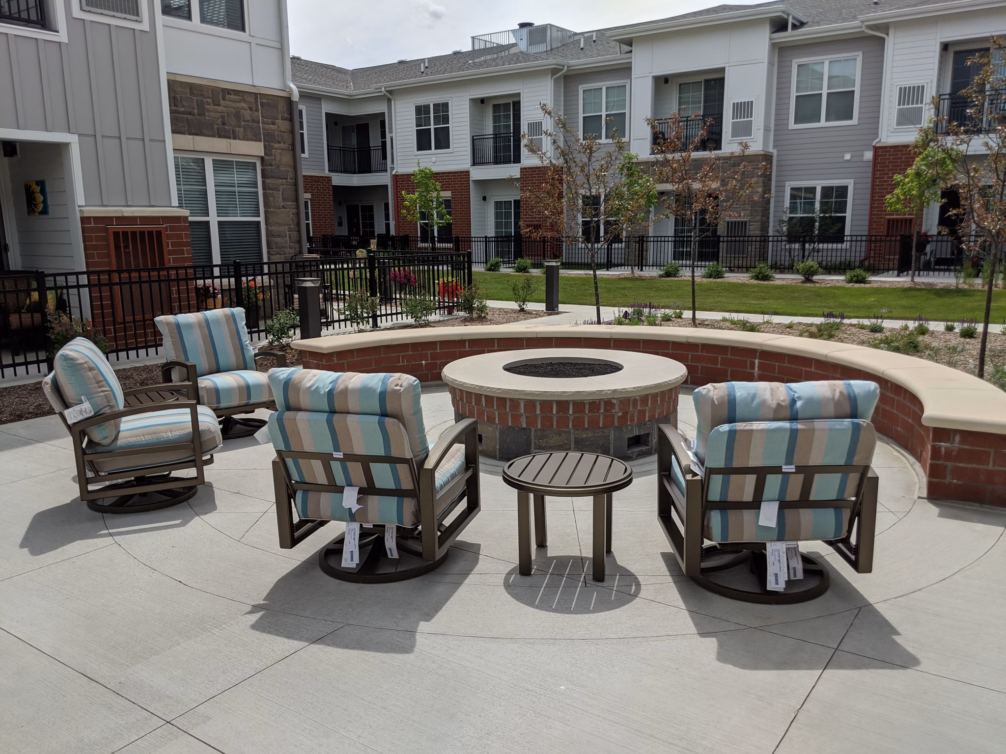 Avenida Naperville: Cozy outdoor fire pit area at luxury apartments in a serene setting