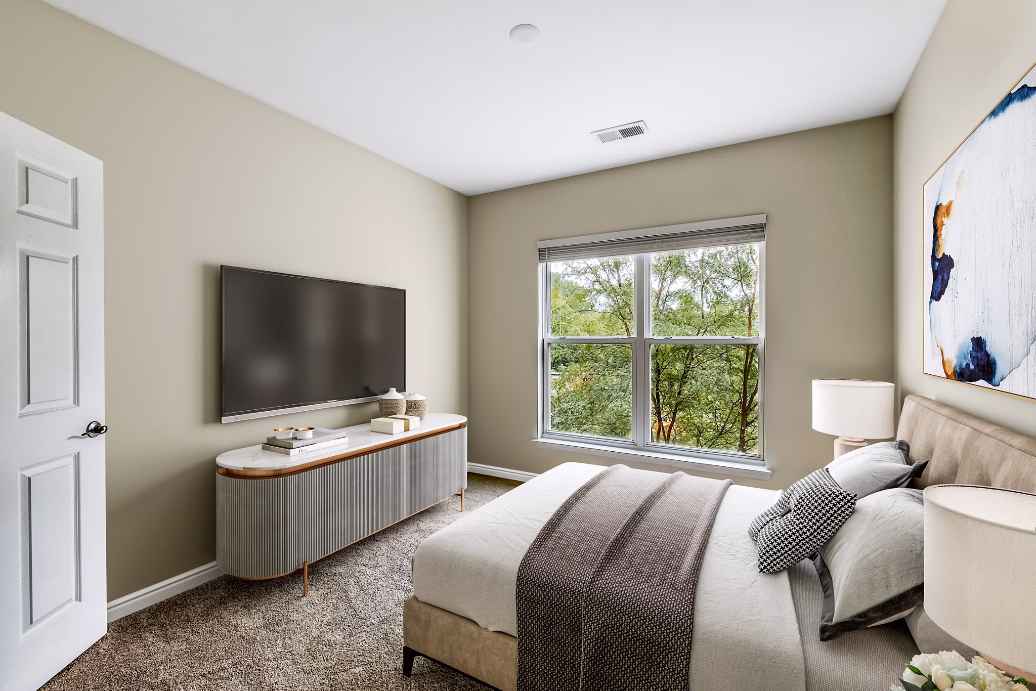 Cozy bedroom with modern furnishings at Mosaic at Largo Station Apartments