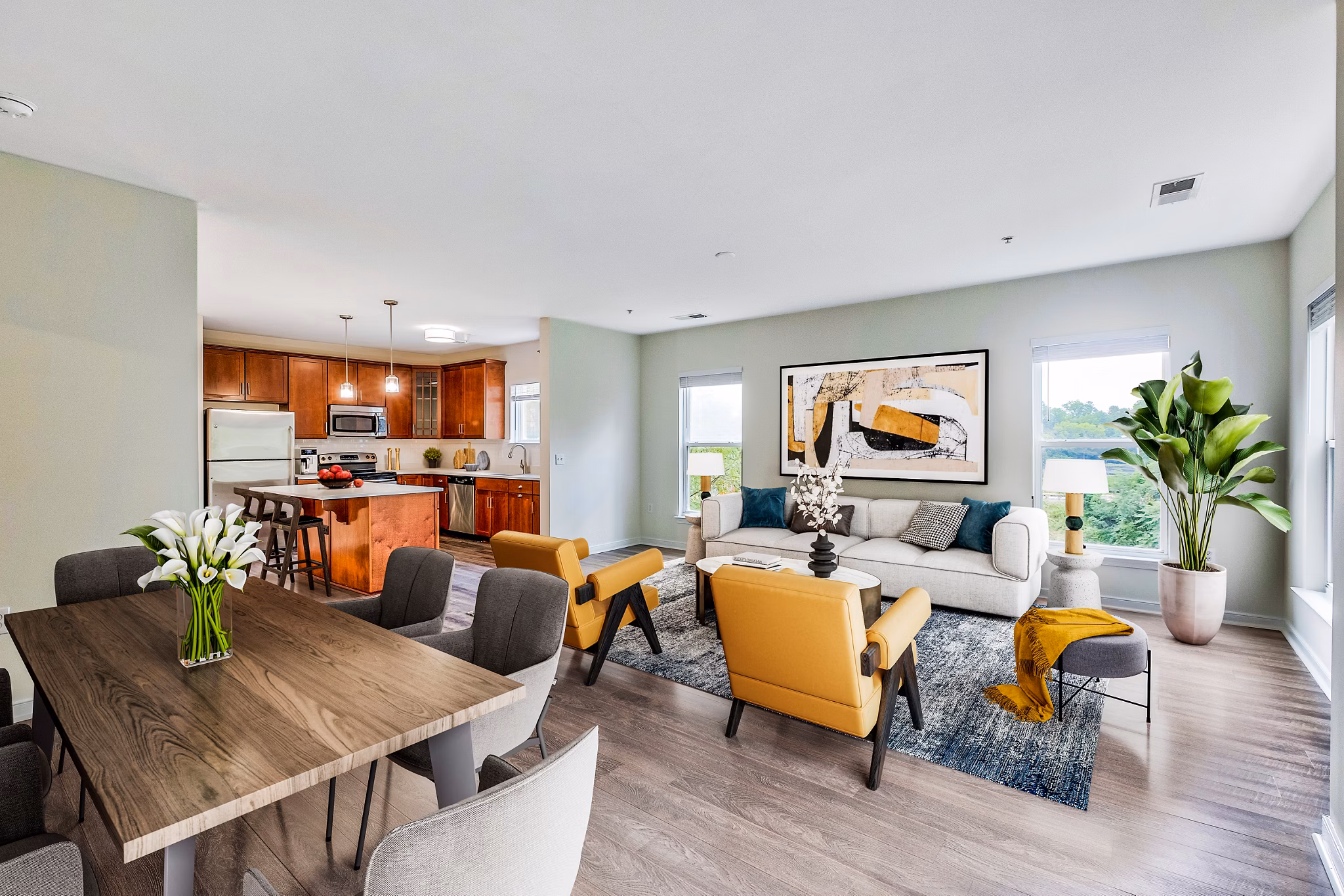 Dining room with elegant furnishings and modern lighting at Mosaic at Largo Station Apartments