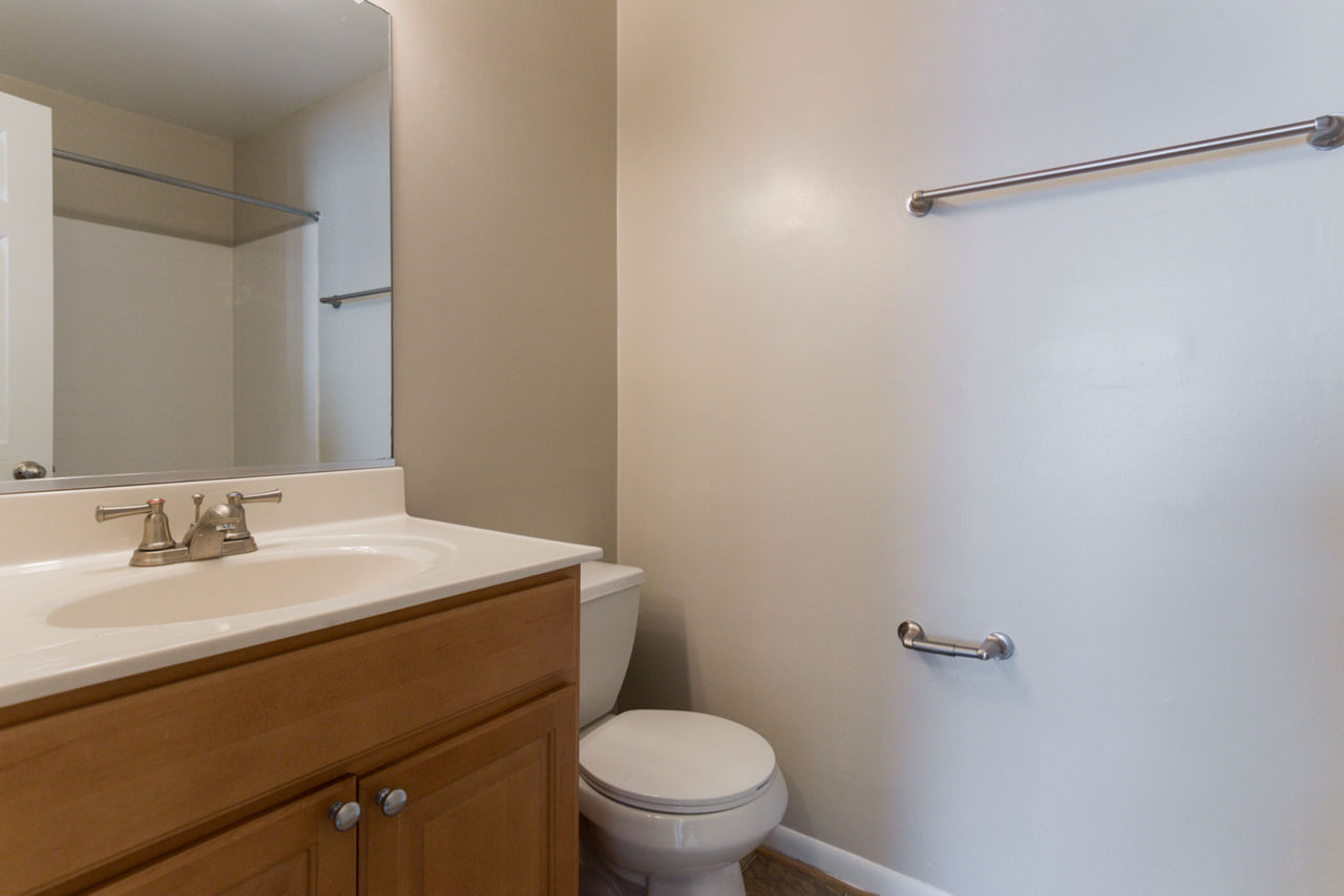 Stylish bathroom featuring modern fixtures and sleek design at Avana Oak Mill Apartments
