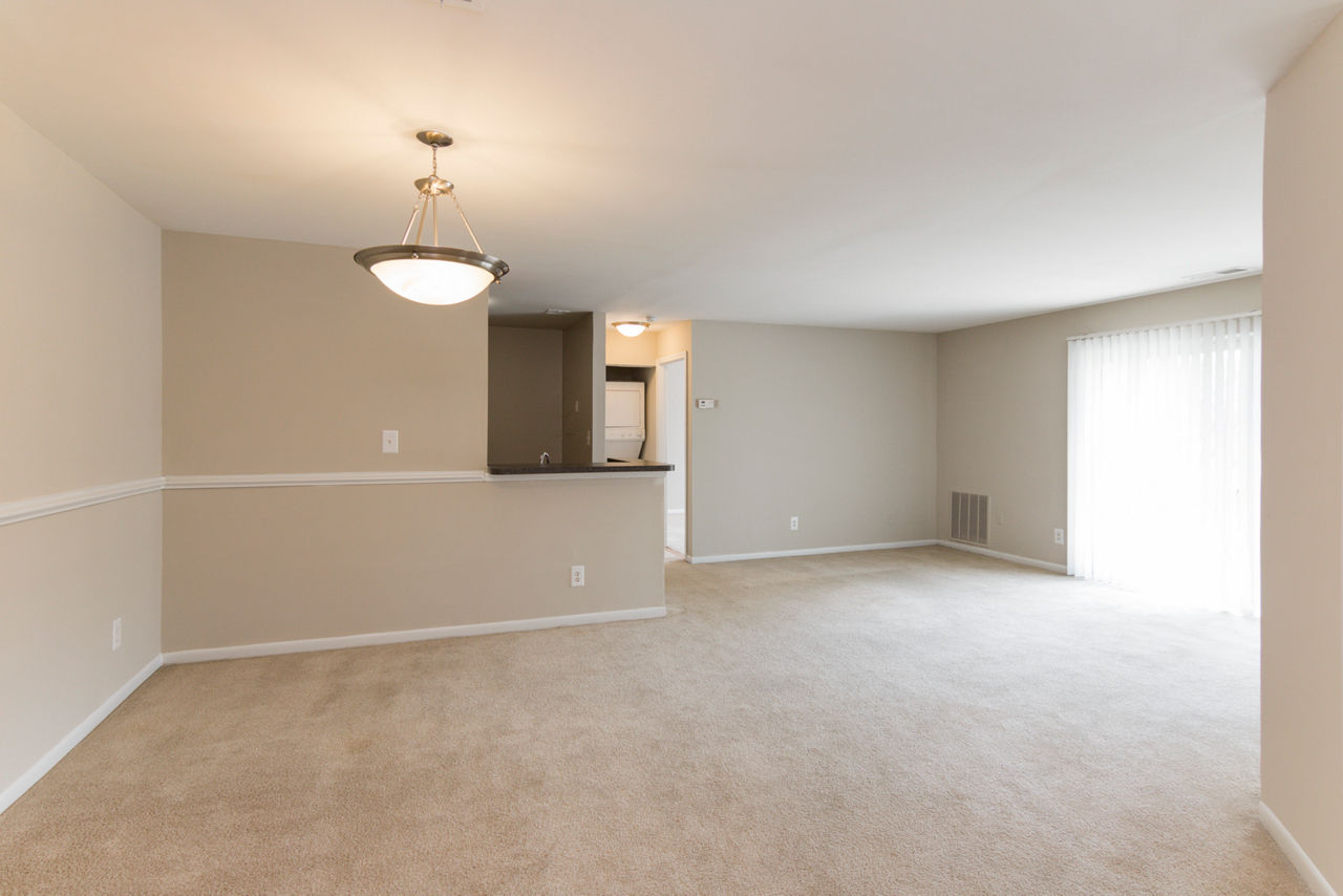 Dining area with modern decor and hardwood floors at Avana Oak Mill Apartments