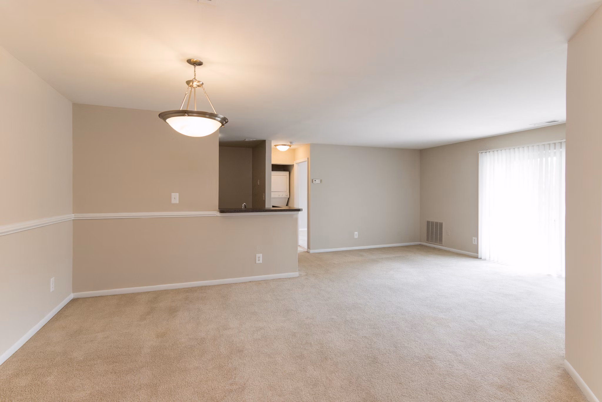Dining area with modern decor and hardwood floors at Avana Oak Mill Apartments