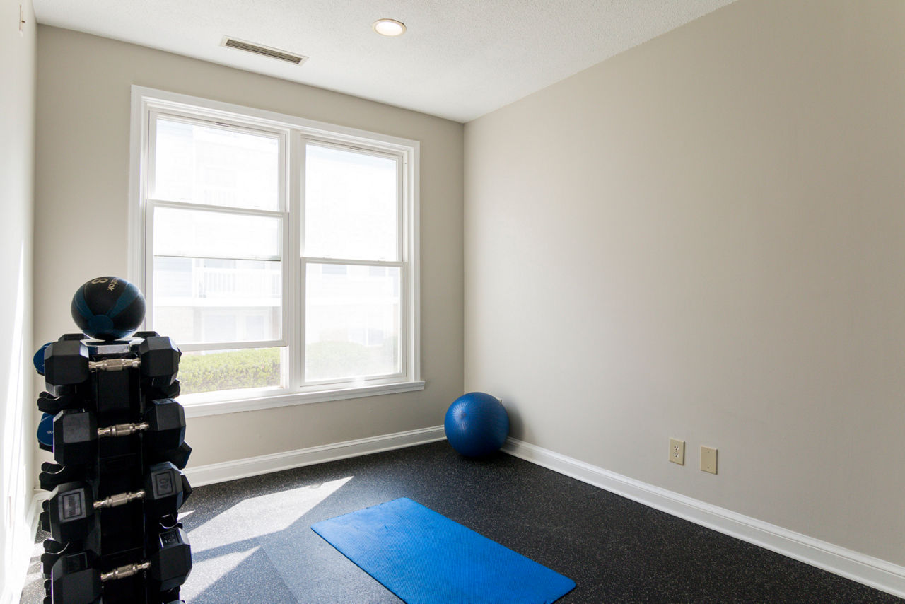 Modern fitness center with state-of-the-art equipment at Avana Oak Mill Apartments
