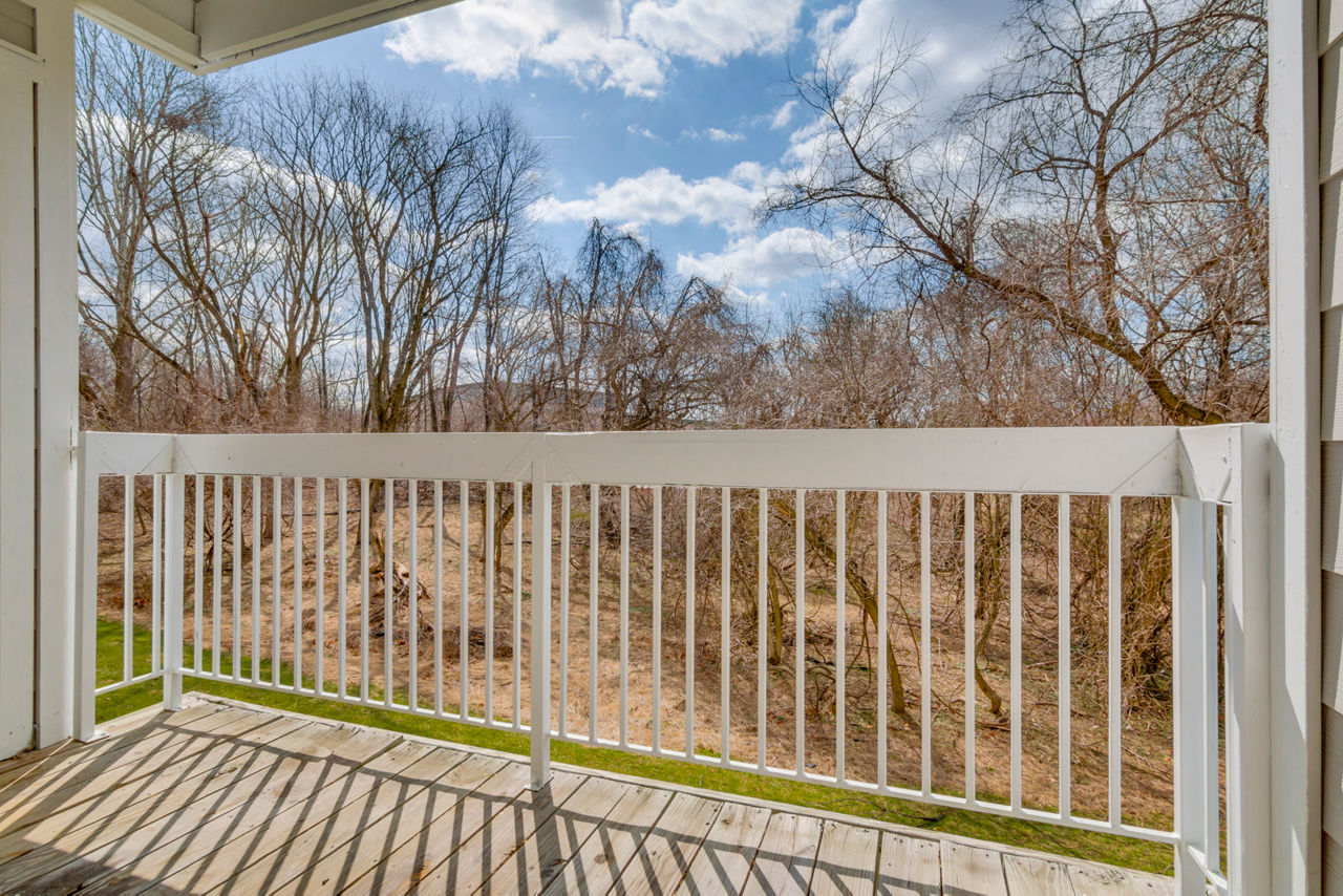 Elegant outdoor patio with cozy seating at Avana Oak Mill Apartments, ideal for relaxation and gatherings