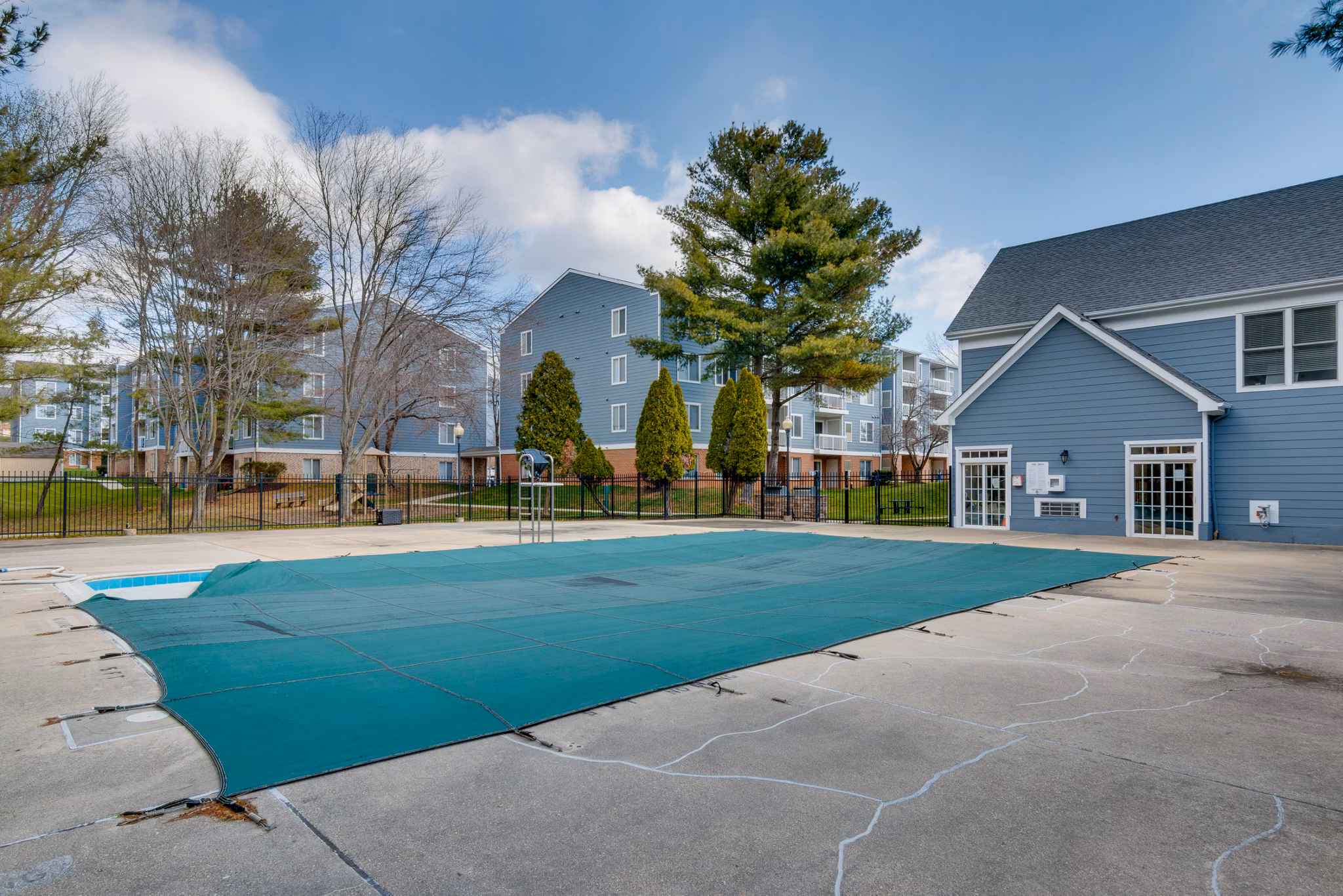Inviting outdoor pool with lounge chairs at Avana Oak Mill Apartments