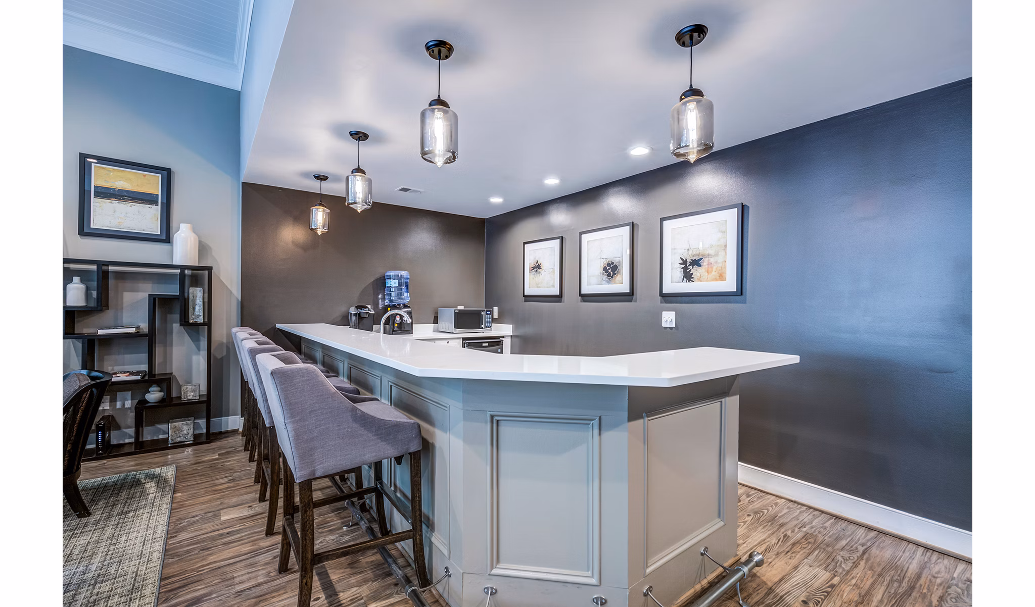 Cozy clubhouse bar with ambient lighting at Avana Heather Ridge Apartments, perfect for socializing and relaxation