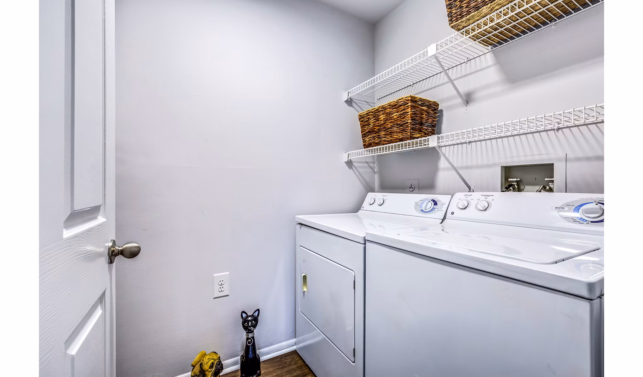 Laundry room with modern appliances at Avana Heather Ridge Apartments