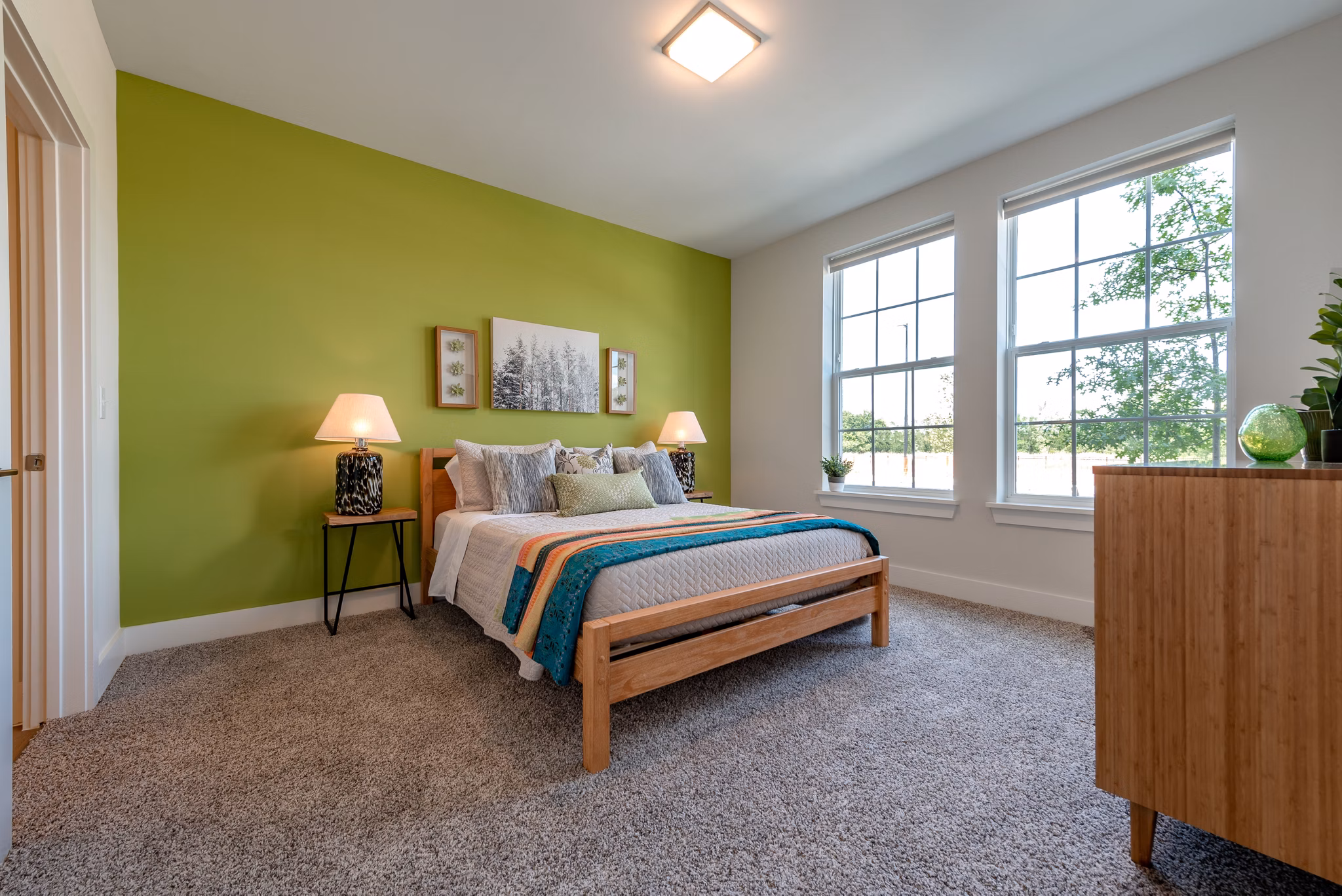 Spacious bedroom with modern decor at Addison Row luxury apartments