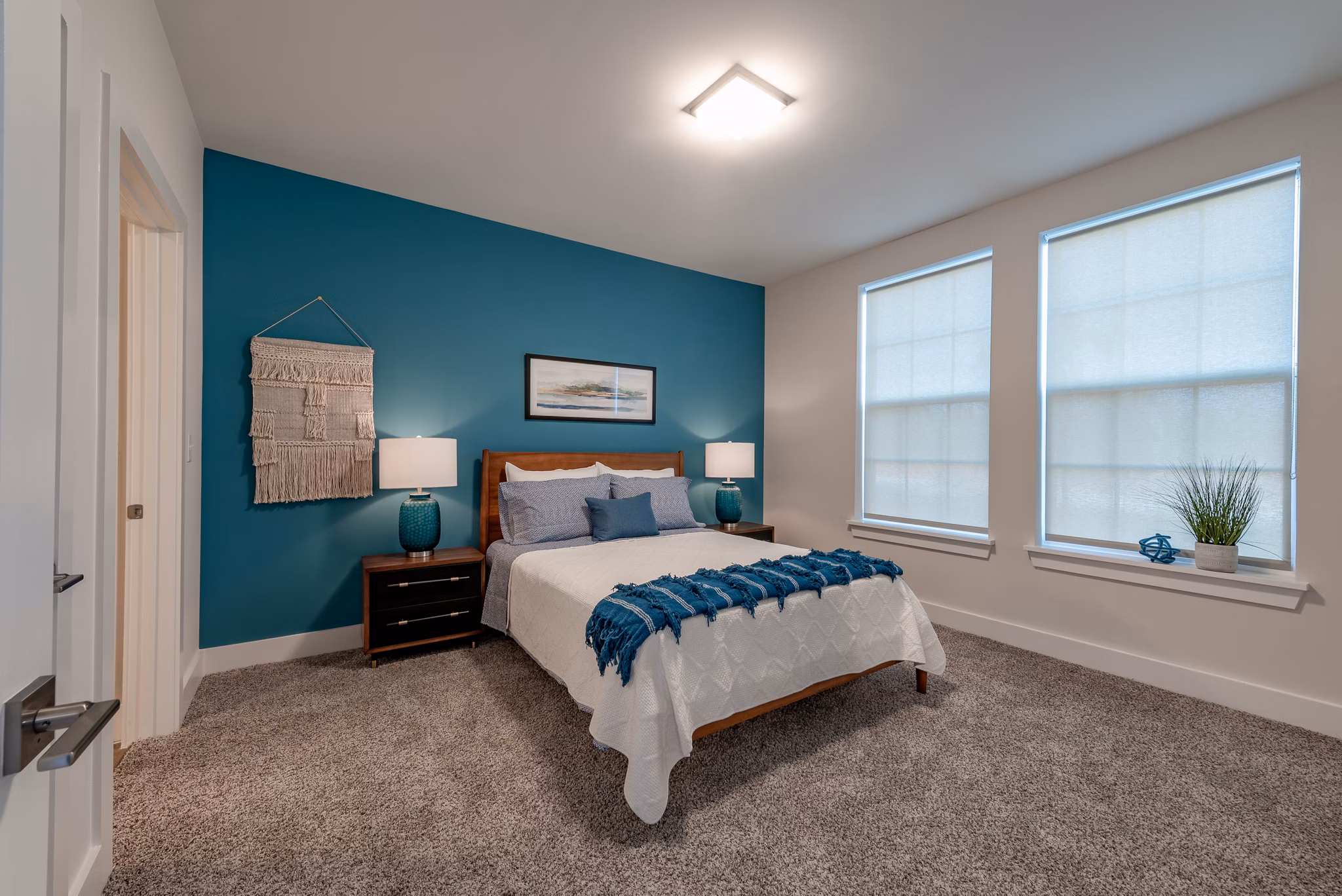Modern kitchen with stainless steel appliances in Addison Row luxury apartments