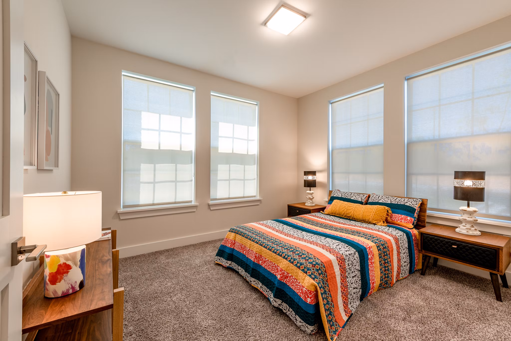 Cozy bedroom featuring modern decor in Addison Row luxury apartments