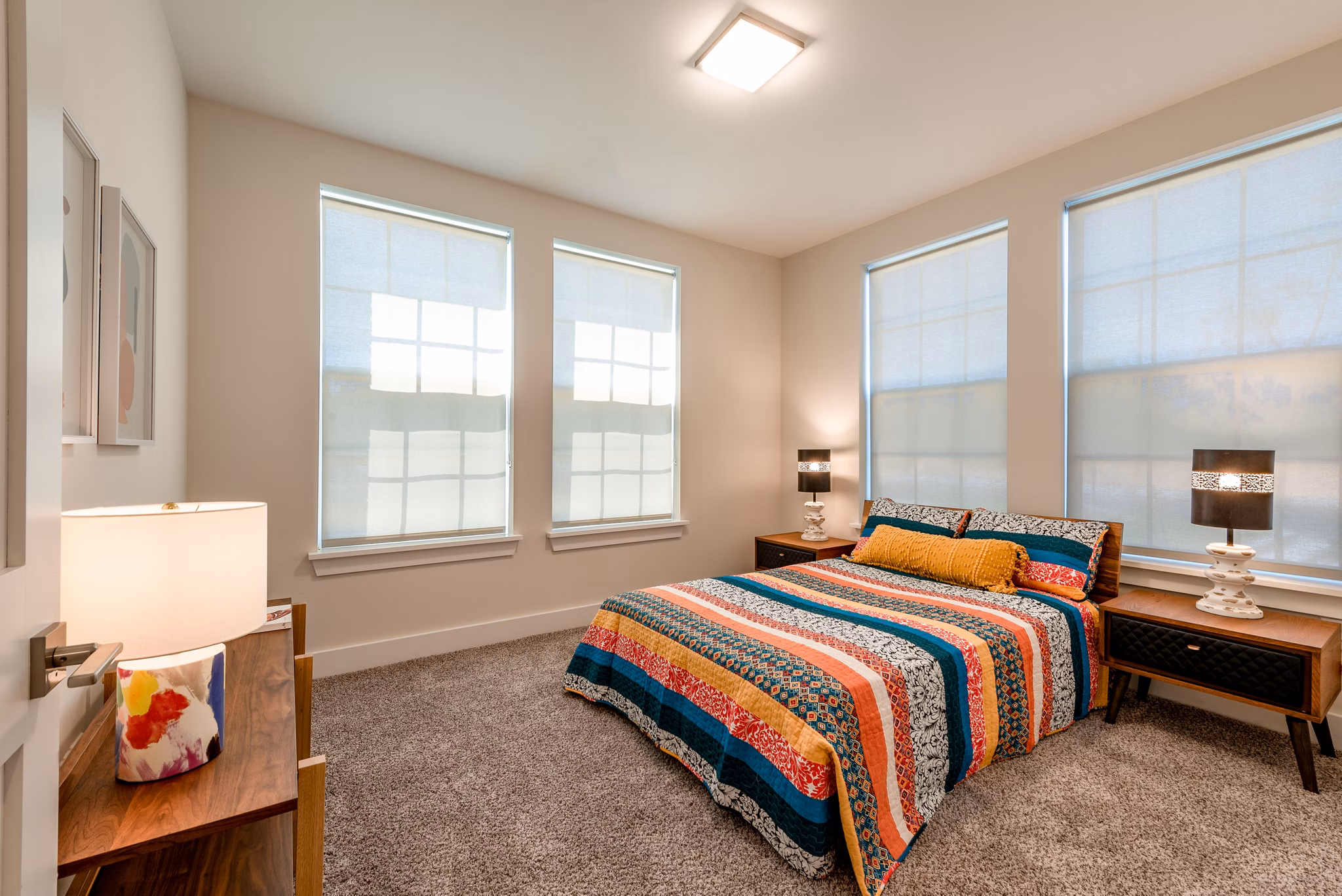 Cozy bedroom featuring modern decor in Addison Row luxury apartments