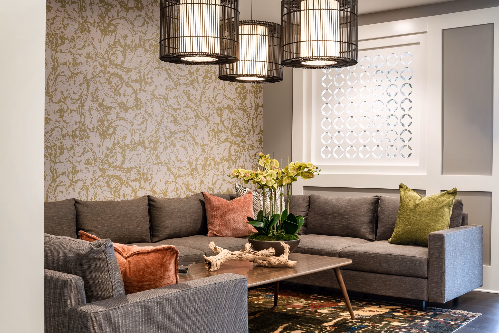 Modern living room with gray sofas and decorative pillows in luxury apartments