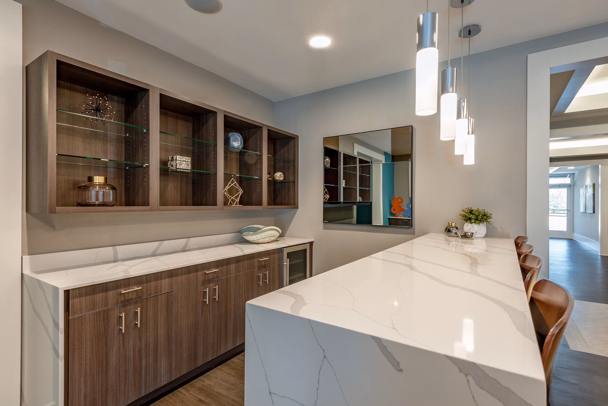 Addison Row: Elegant living room with contemporary design and natural light, highlighting luxury apartment interiors