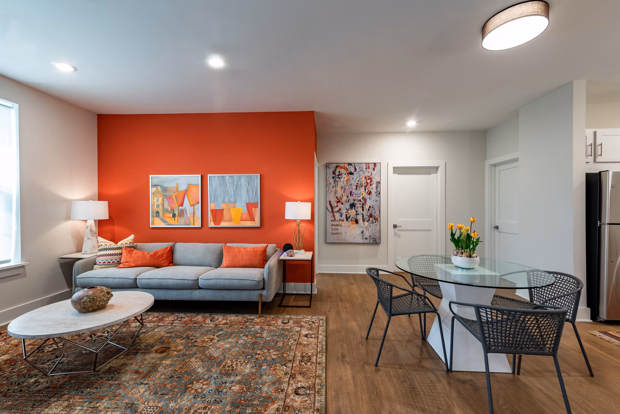 GS Addison Row: Elegant model kitchen with stainless steel appliances and marble countertops in luxury apartment community