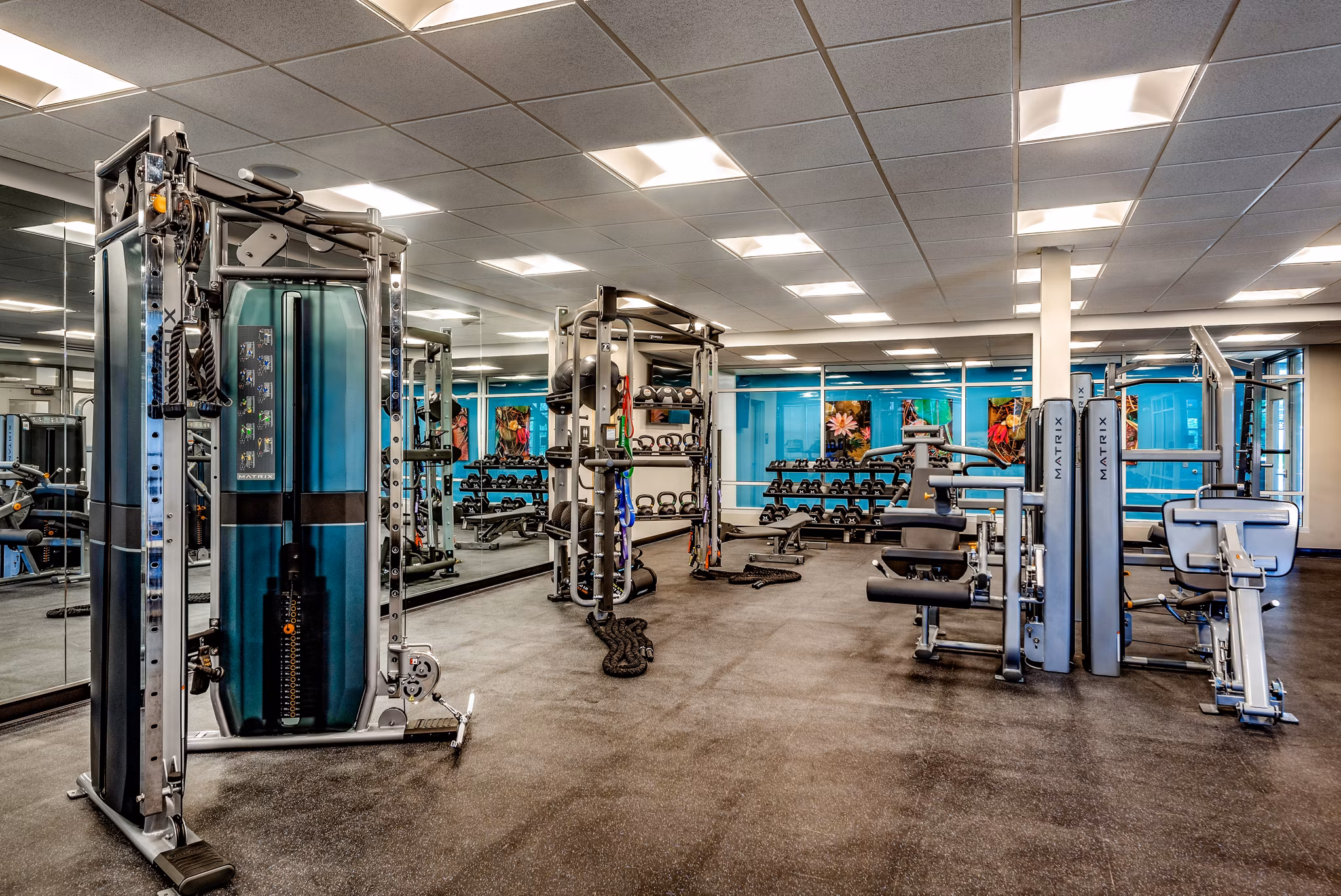 Spacious fitness center with modern equipment at Addison Row apartments