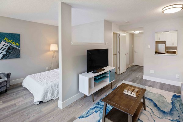 Modern kitchen with stainless steel appliances in The Luckman Apartments