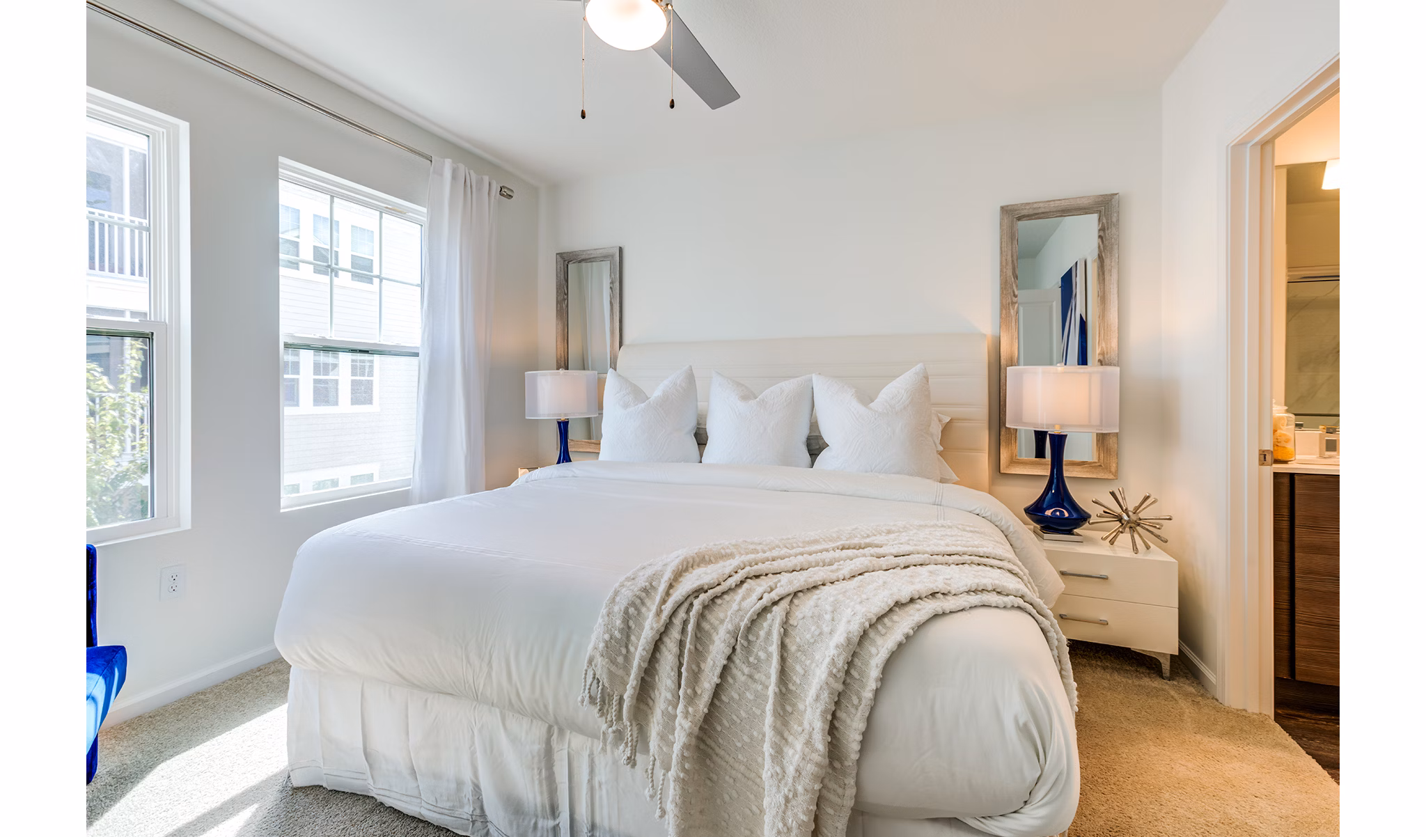 Cozy bedroom with modern decor at Pier 8 at The Preserve Apartments