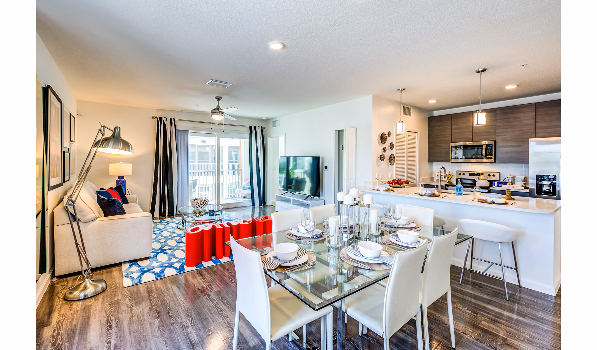 Dining room featuring elegant lighting and modern furniture at Pier 8 at The Preserve Apartments