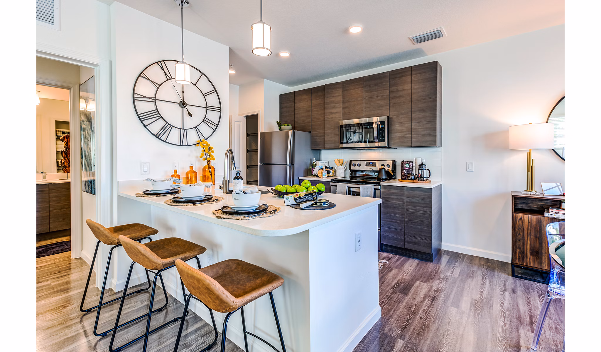 Kitchen featuring modern appliances and sleek cabinetry at Pier 8 at The Preserve Apartments, luxury living space by Greystar